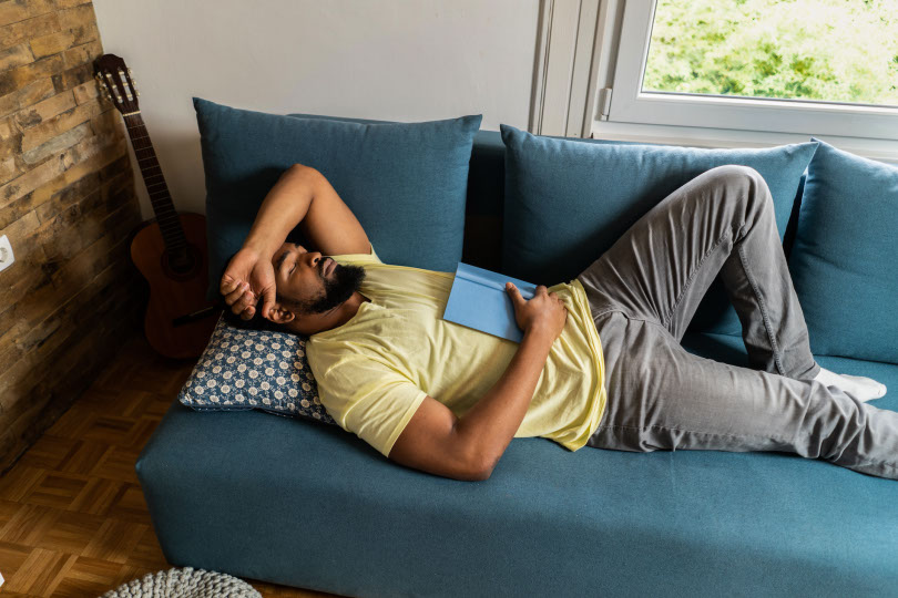 Man asleep on couch.