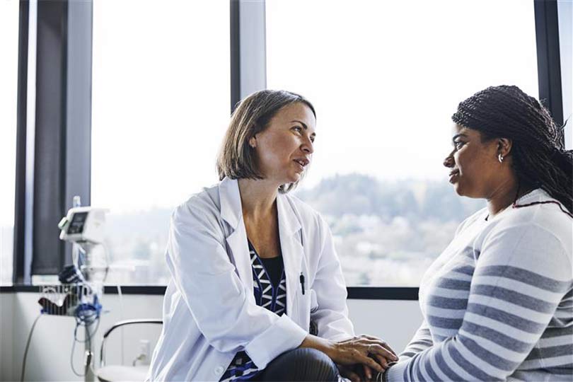 A healthcare provider and a patient during a doctor appointment, discussing kidney health and chronic kidney disease.