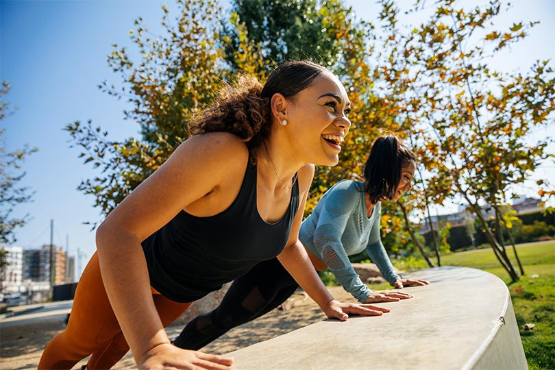 Woman leads outdoor fitness class