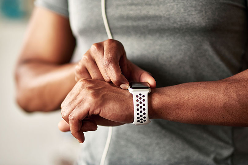 A man checks smartwatch.