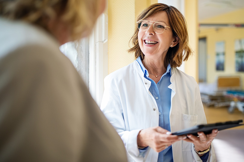 A woman consults with a doctor, emphasizing the importance of effective health care communication.