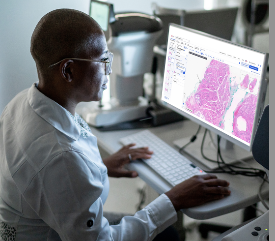 Laboratory professional reviewing tissue samples.
