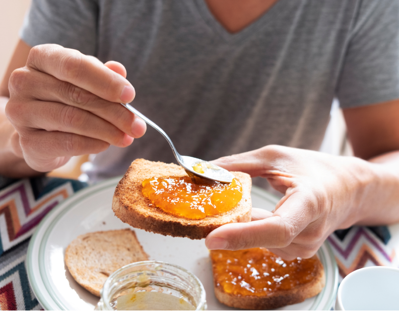 man having bread with jam