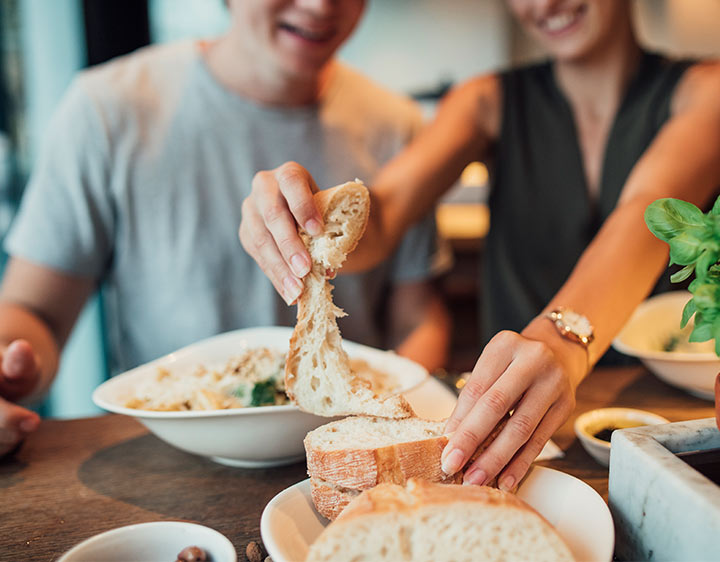Two people enjoying a healthy, nutritious meal together.
