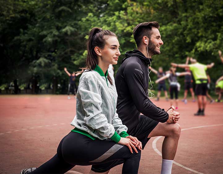 Man and woman jogging outdoors.