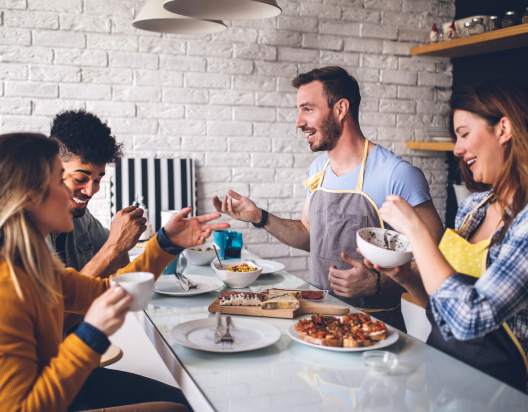 Friends eating meal together. 