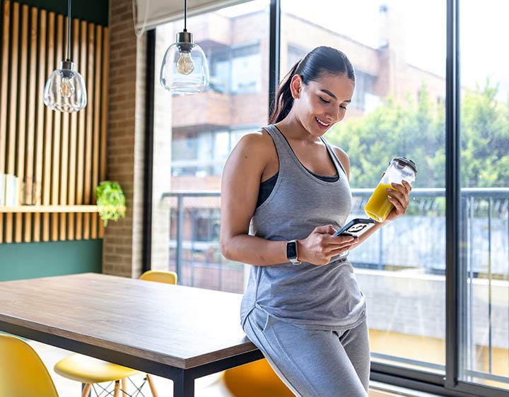 Healthy woman checking in on health records.