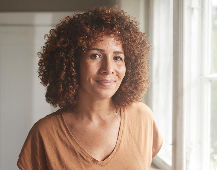 Middle-aged woman navigating the menopause journey with hormone testing.
