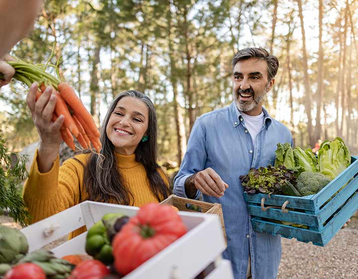 Man and woman picking out healthy produce