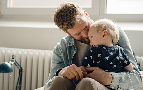 father holding baby