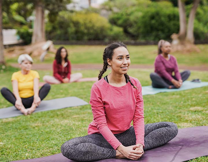PCOS females exercising outdoors to optimize hormone levels.