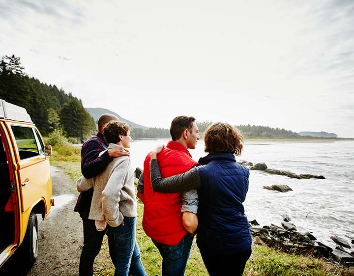 Two couples enjoying a road trip adventure along the coast