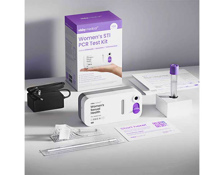 Image showing kit components, including the box, device, power cord, vaginal swab and sample tube