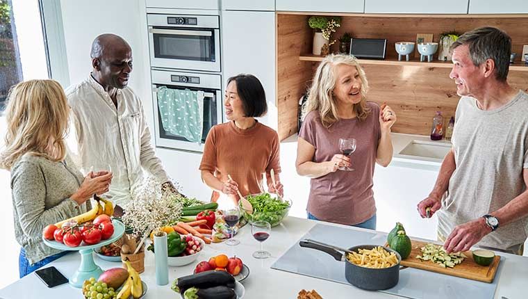 Diverse group of middle-aged adults discussing liver health.
