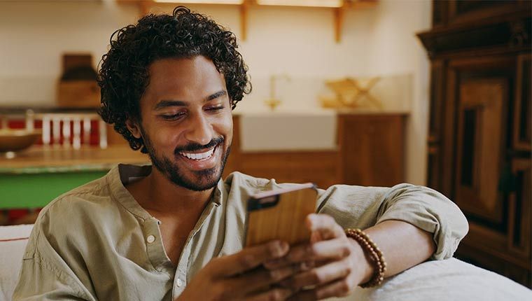 Man looking at the phone.