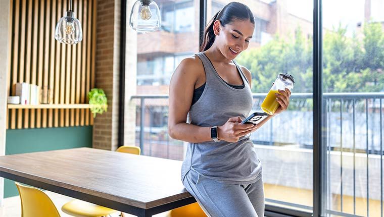 Healthy woman checking in on health records.