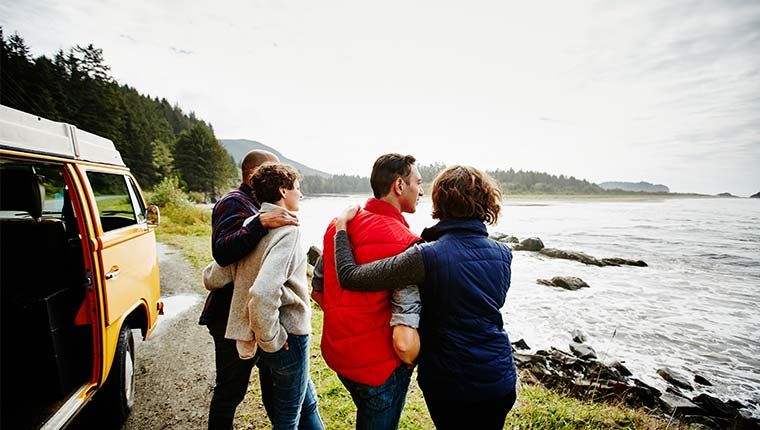 Two couples enjoying a road trip adventure along the coast.