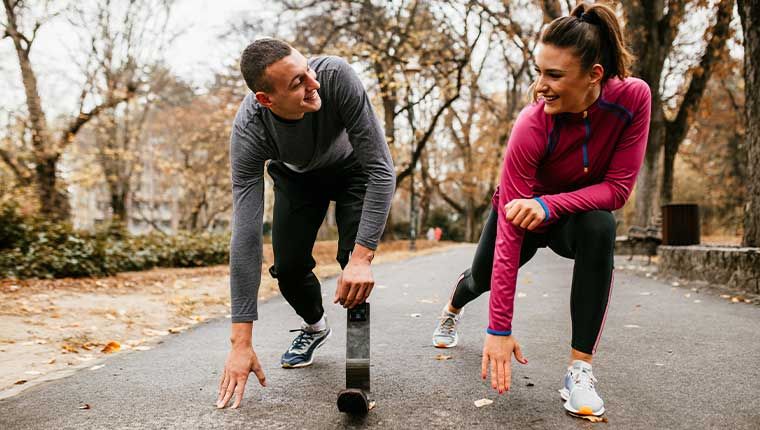 Young man and woman active outdoors maintaining healthy thyroid function.