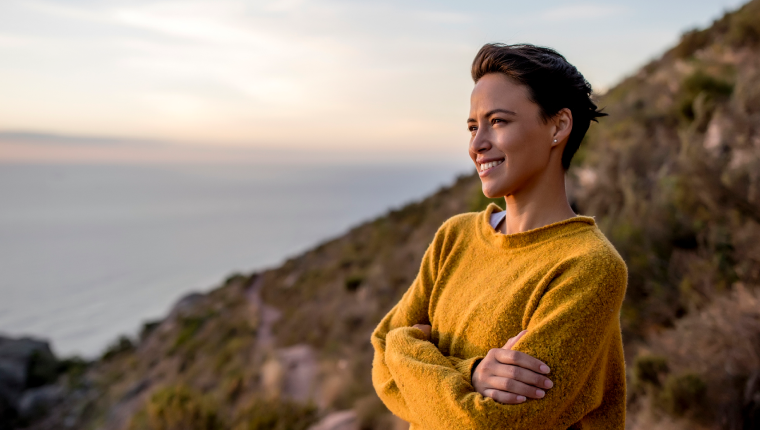 Woman enjoys sunset view.